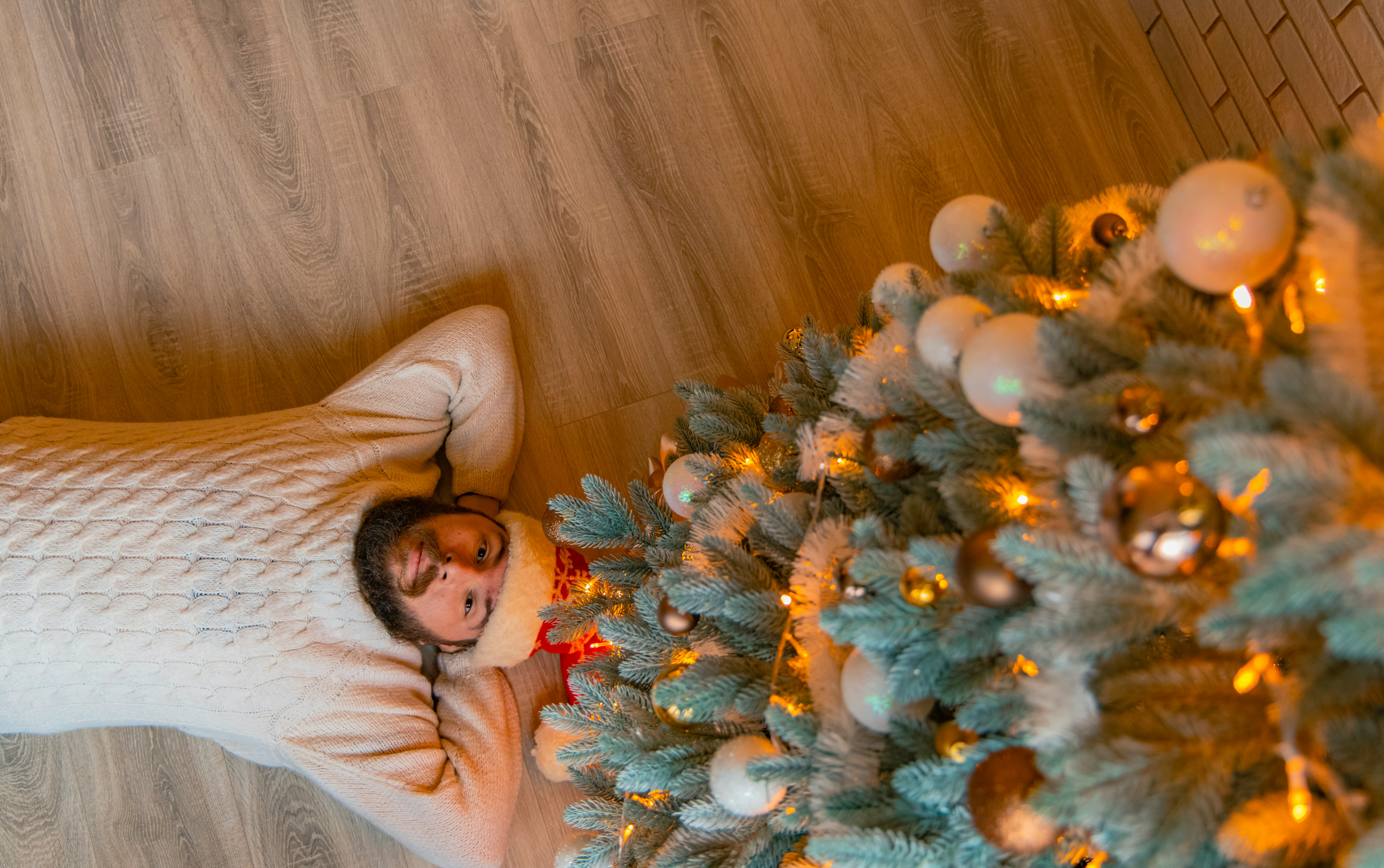 woman in white long sleeve shirt lying on bed